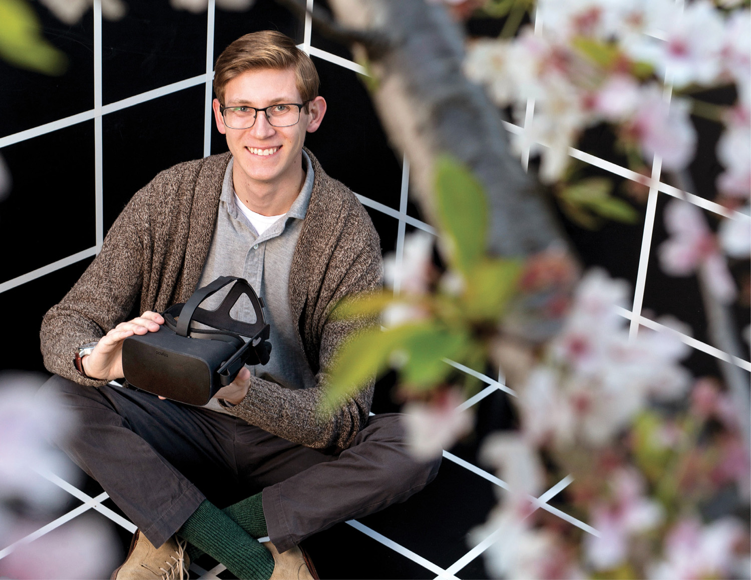 photo of Christian Motyczka holding virtual-reality goggles