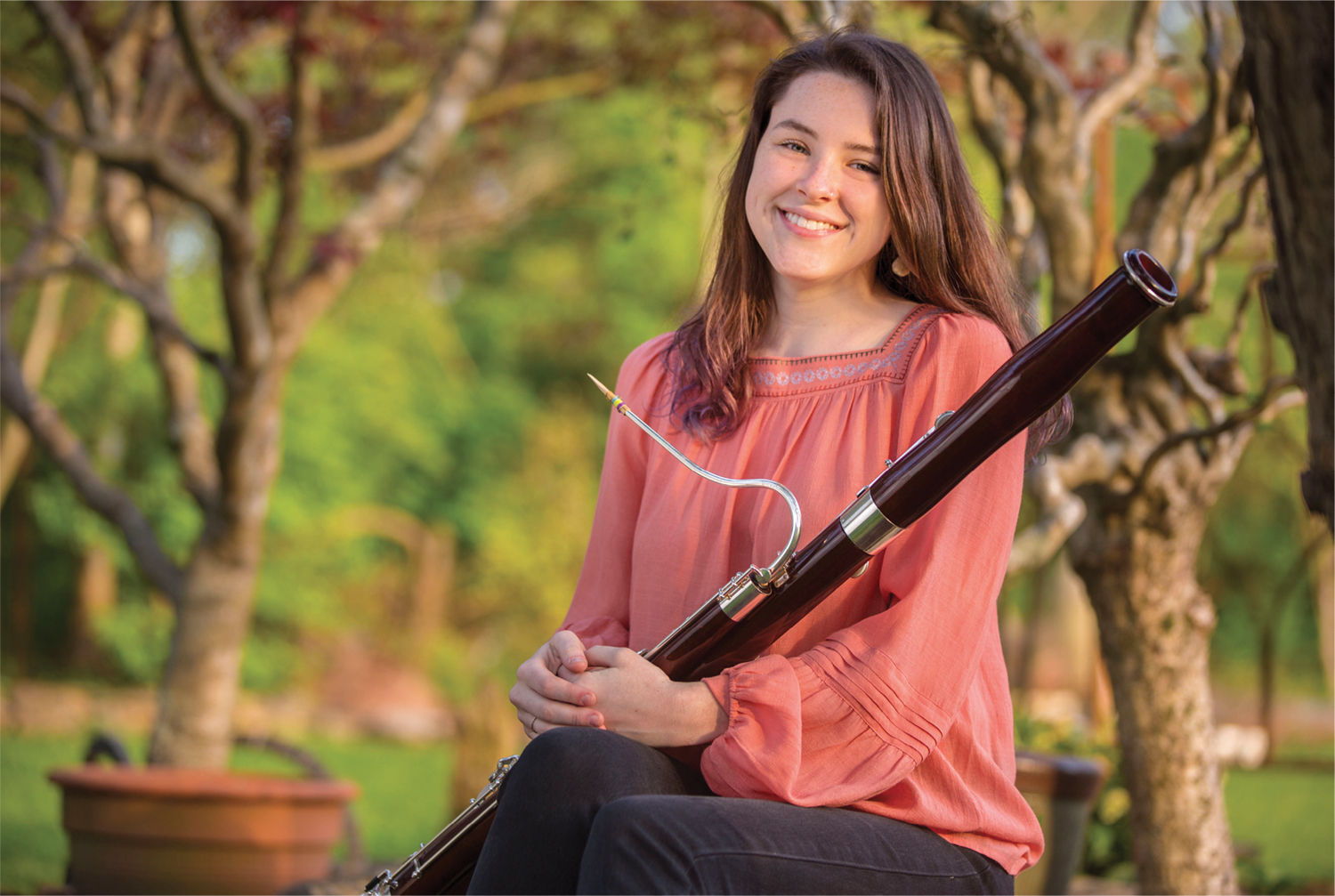 photo of Sarah Robinson holding a bassoon 