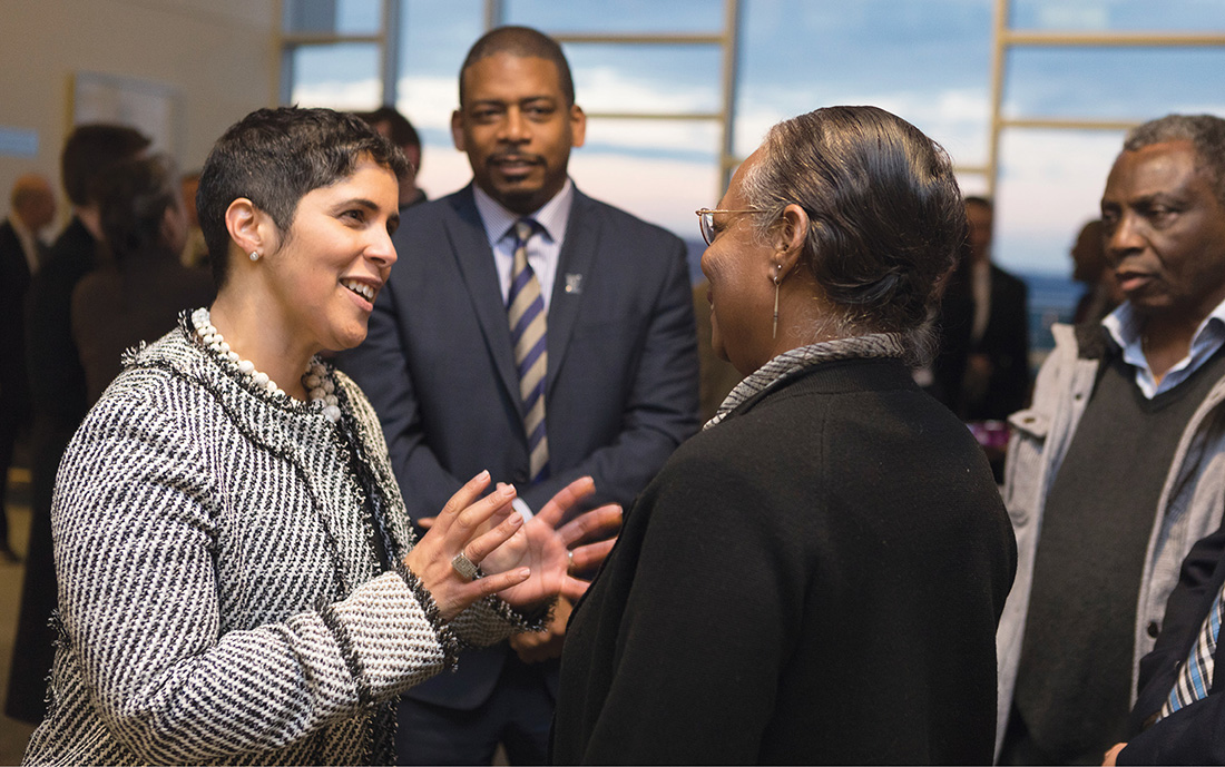 Collado, left, meets faculty and staff of Ithaca College the day her appointment as president was announced. At center is Collado’s husband, award-winning poet A. Van Jordan, who now is a distinguished visiting professor at Ithaca. Jordan was recipient of a 2007 John Simon Guggenheim Fellowship and the 2016 Lannan Literary Award in Poetry, among other honors, and is a professor of English language and literature at the University of Michigan. (ADAM BAKER / COURTESY OF ITHACA COLLEGE)