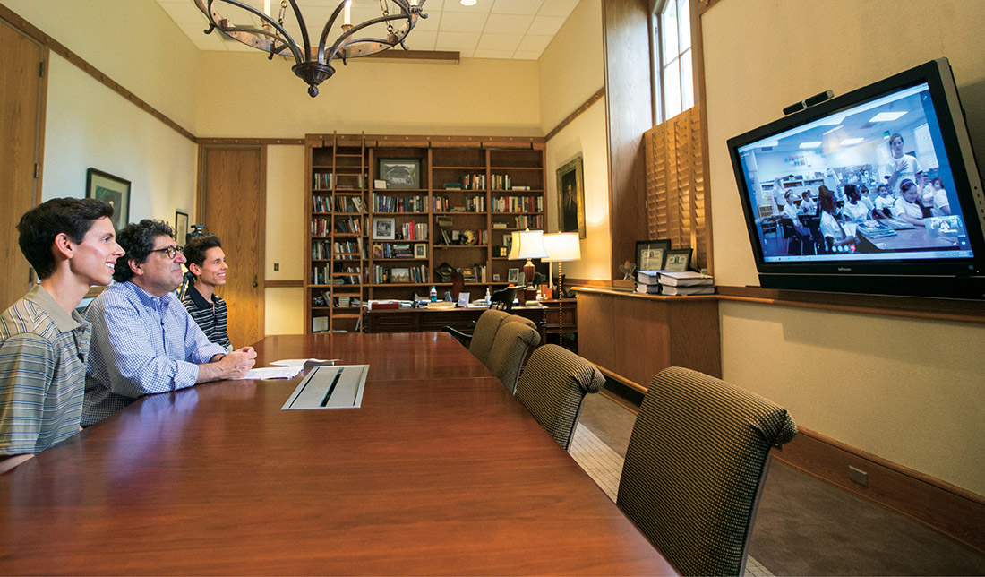 Chancellor Nicholas S. Zeppos joins first-year students Aaron and Nicholas Ainsworth in a video chat with sixth- grade students in the brothers’ California hometown to encourage them to pursue college. (JOHN RUSSELL)
