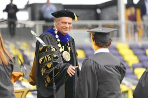 Chancellor Daniel Diermeier shaking hands with 2024 Vanderbilt graduates (Vanderbilt University)