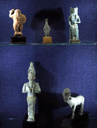 Ancient Egyptian figures representing various gods and goddesses are on loan from Emeritus Professor Douglas Knight for the "Cultures in Clay" exhibition. (Steve Green/Vanderbilt)