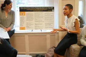 Anana Upton speaks at the PreSpecialty Student Poster Presentations.