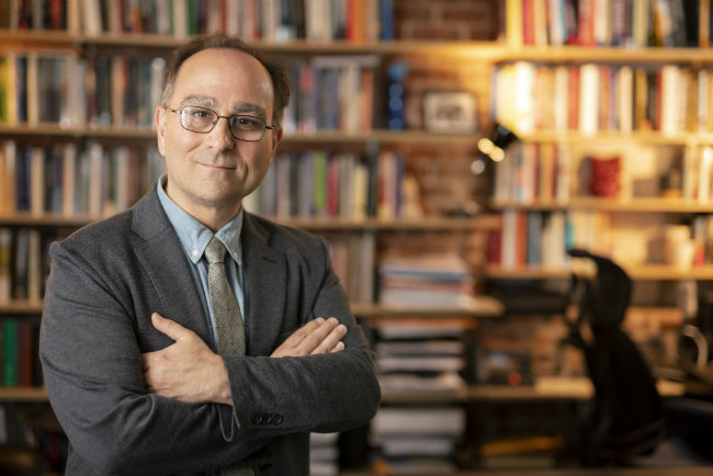 environmental photo of Robert Talisse in frone t of book case (photo by Vanderbilt University's Joe Howell)Jo