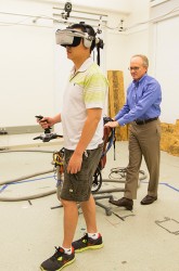 Student walking while wearing VR headset