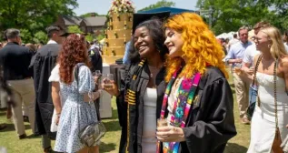 Students and their families celebrate on Alumni Lawn with Strawberries and Champagne following the Class of 2022 Commencement at Vanderbilt Stadium.