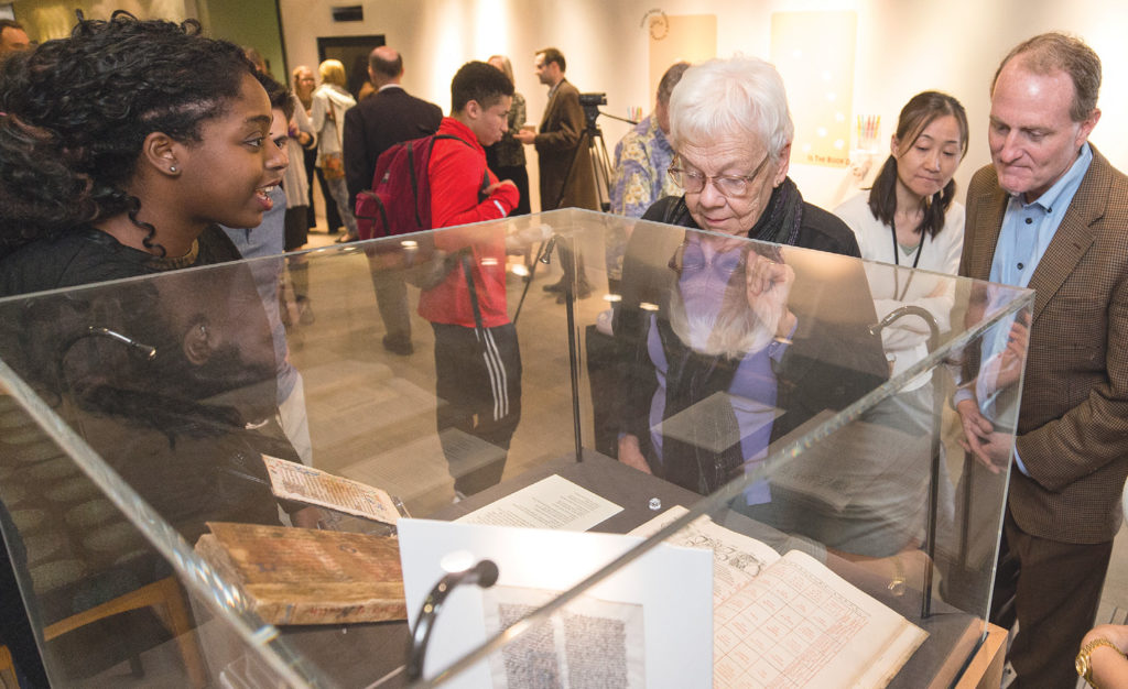 Fall 2017 Buchanan Library Fellow Tori Phillips, left, describes her display case during a program to highlight the fellows’ research projects. (JOE HOWELL)