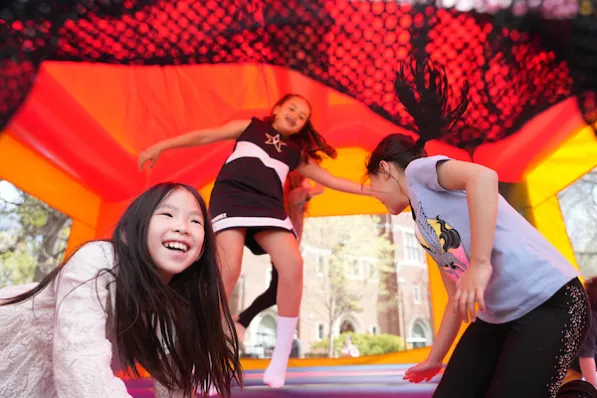 The community party on Alumni Lawn included a bounce house and other family-friendly activities. (Joe Howell)