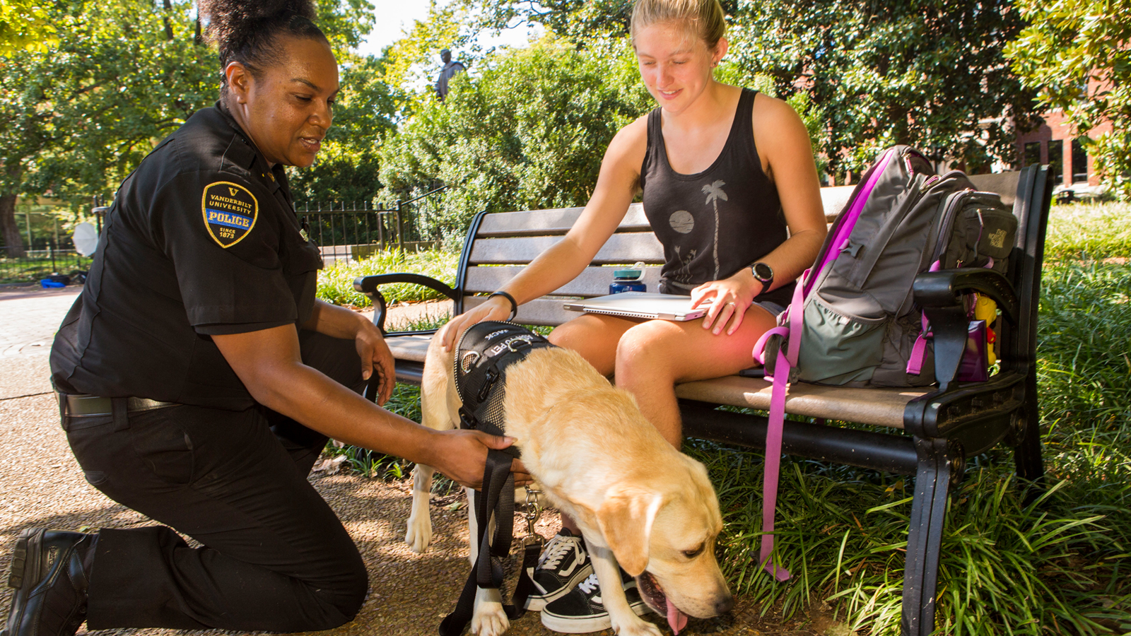 Community K-9 Patrol "Jack" the new community K-9 with his handler, Corporal Lewis. People gravitate toward Jack, and he loves the attention. Lewis said he’s an expert at “working the room” when she takes him to a community gathering or residence hall. “Whatever the event is, he’ll be the star of it,” she said. Lewis and Jack completed “Paws and Stripes College,” a companion/therapy dog training program through the Brevard County, Florida Sheriff’s Office, earlier this year. The program finds shelter or rescue dogs and pairs them with county jail inmates who are tasked with training the dogs on advanced obedience skills under the supervision and direction of a professional K-9 trainer. In addition, Lewis and Jack participate in regular obedience training and continue to sharpen their skills as Vanderbilt’s community K-9 patrol team. Photo: Anne Rayner; VU