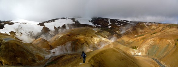 Panoramic photo of Miller standing on a hilltop