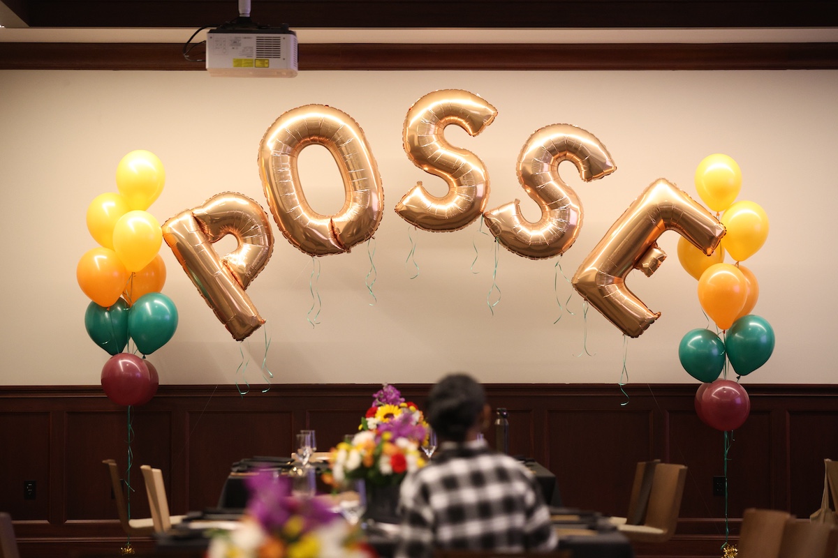 Gold foil balloons spell out "POSSE"