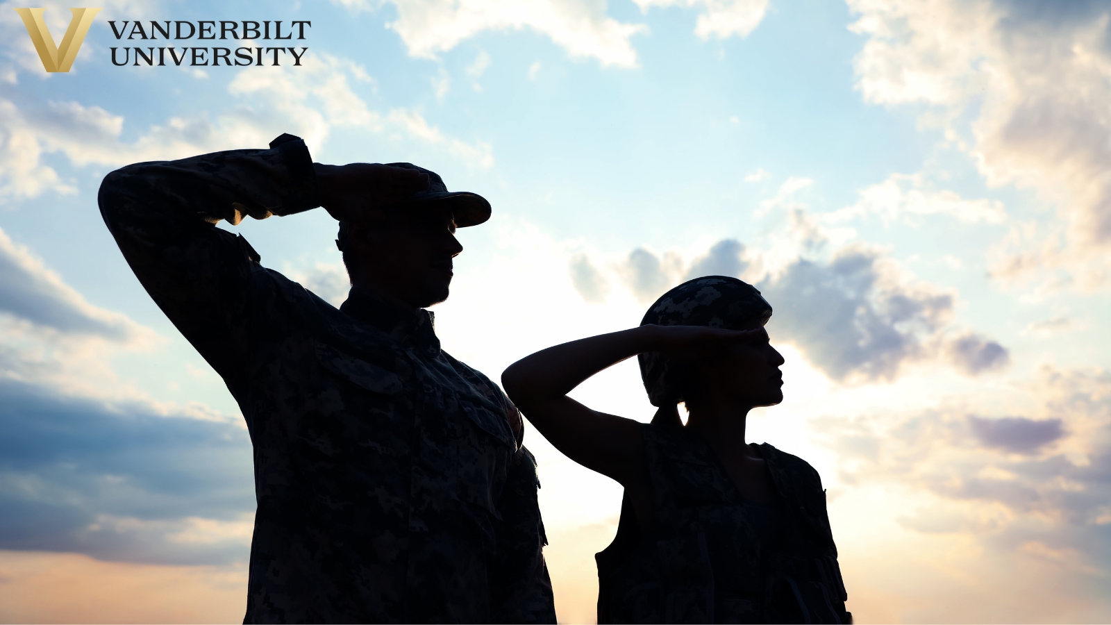 The silhouettes of two soldiers saluting over a bright sunrise. 
