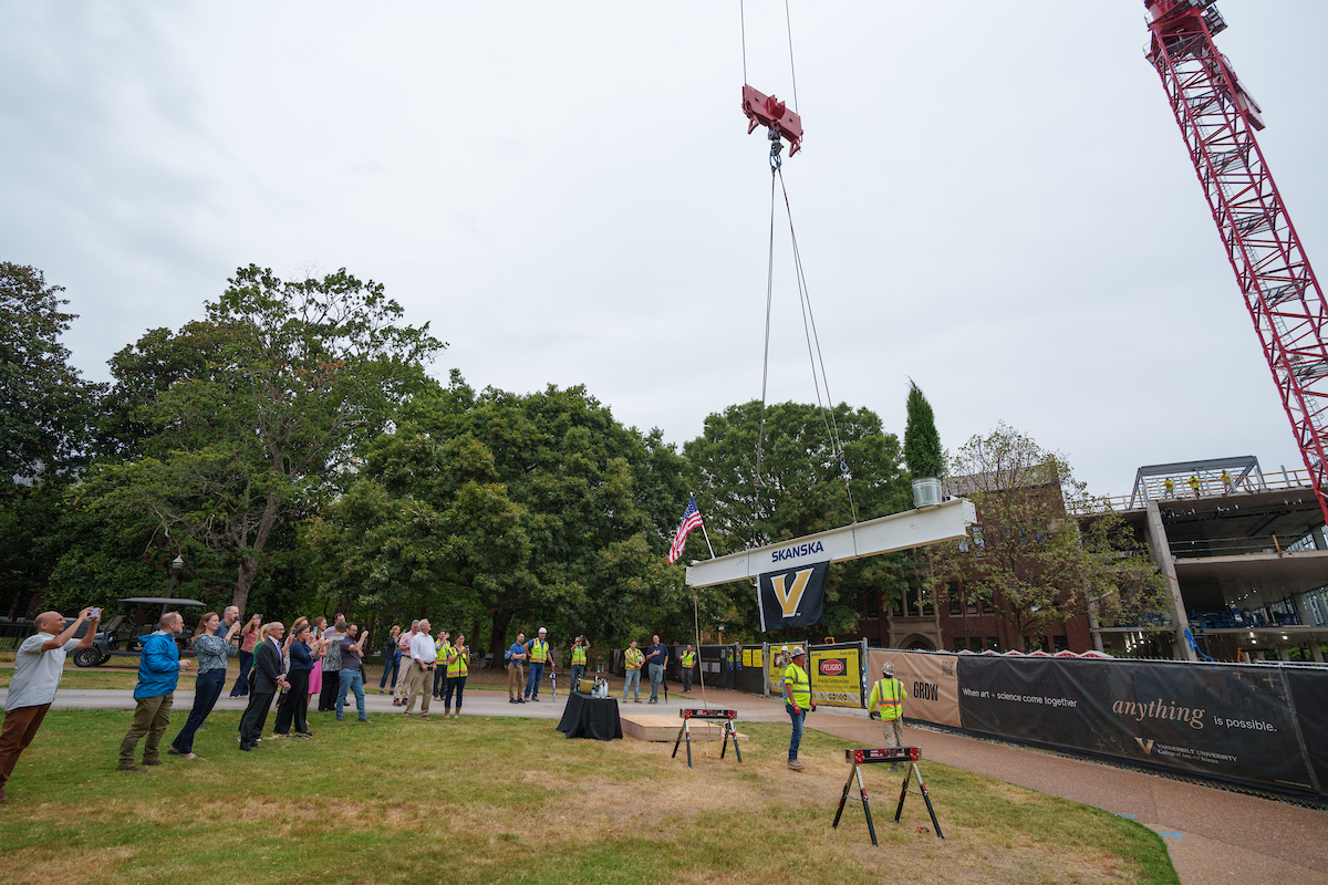 Guest watch as the final iron beam is placed on Garland Hall. 