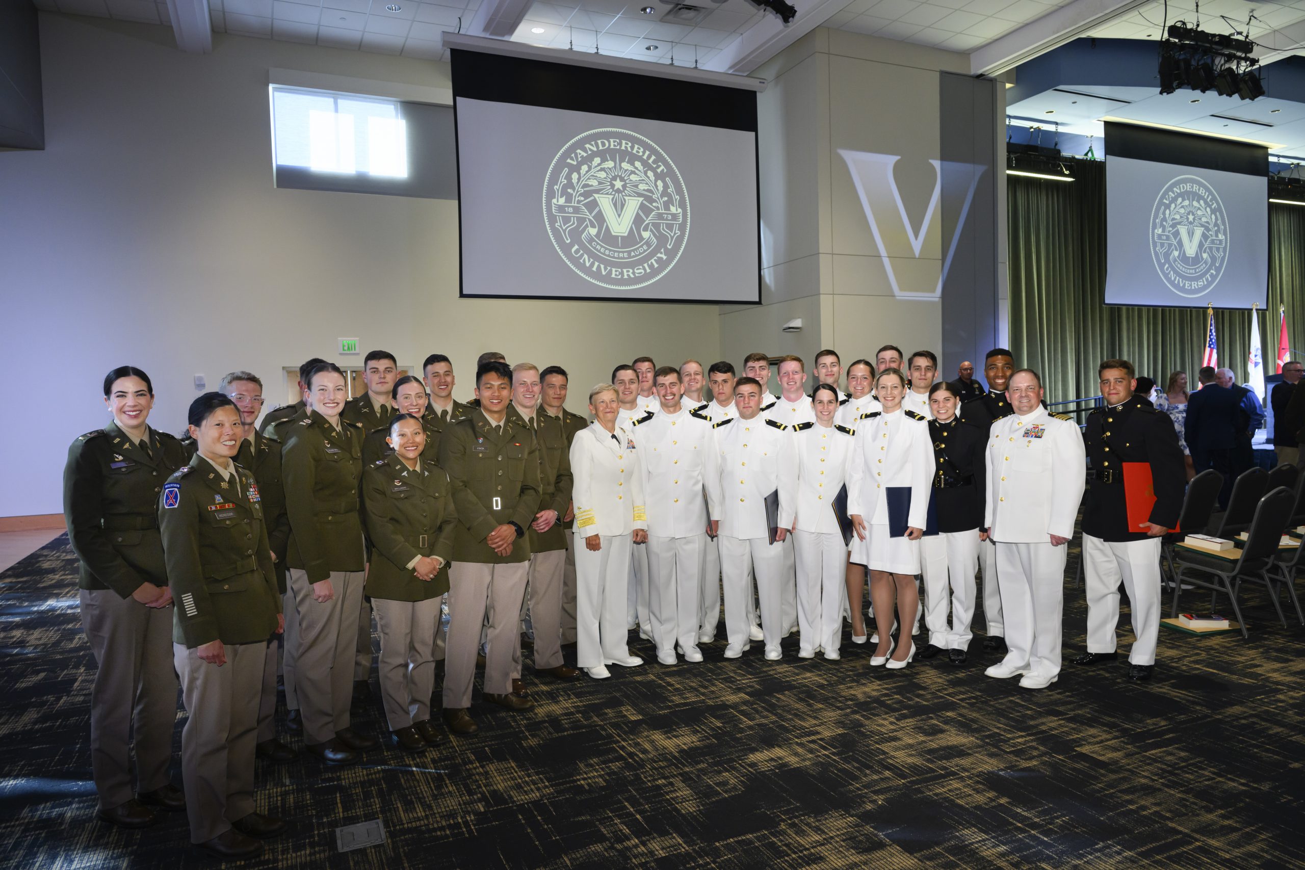Graduates and leadership pose for a photo at the Reserve Officer Training Corps Joint Commissioning Ceremony. (Vanderbilt University)
