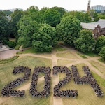 Class of 2024 poses in the shape of "2024"