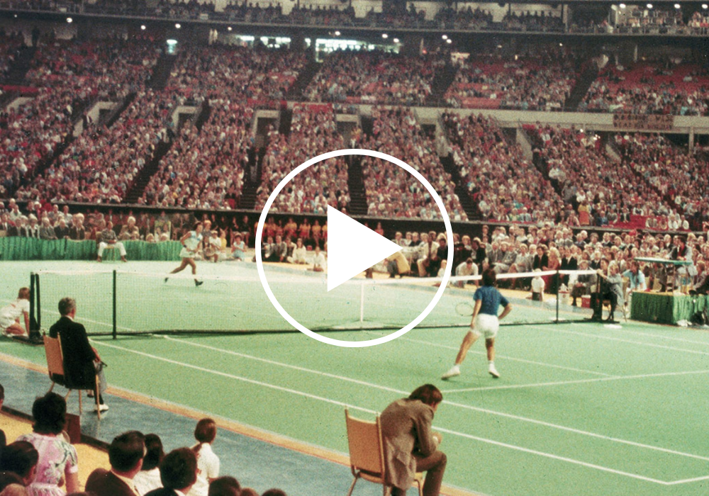 Video still from the 'Game, Set, Match: A New Era of Equality in Sports" video, featuring Billie Jean King playing tennis.  