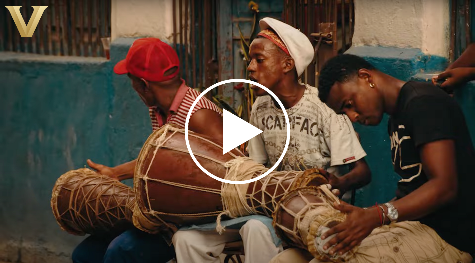 Video still of an image from the Slave Societies Digital Archive depicting three African men playing the drums. 