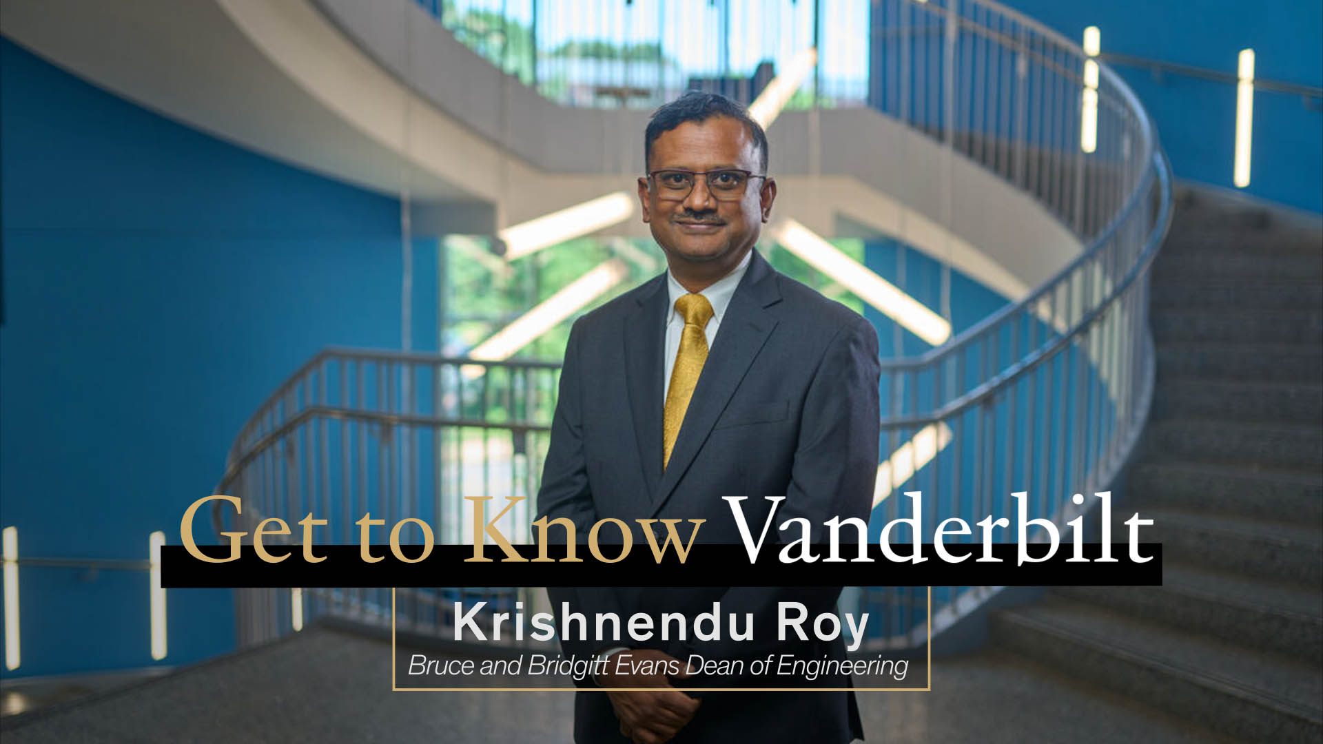 Vanderbilt School of Engineering Dean Krishnendu Roy stands in the engineering building; Overlay text reads: "Get to Know Vanderbilt" above "Krishnendu Roy, Bruce and Bridget Evans Dean of Engineering"