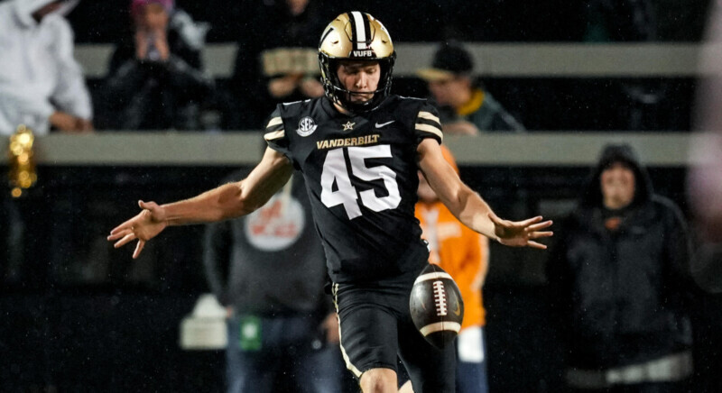 Vanderbilt football's Matthew Hayball sends a punt flying during a game 