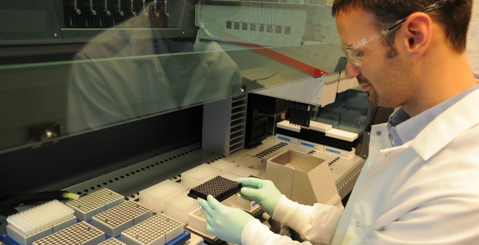 Scientist and test tubes