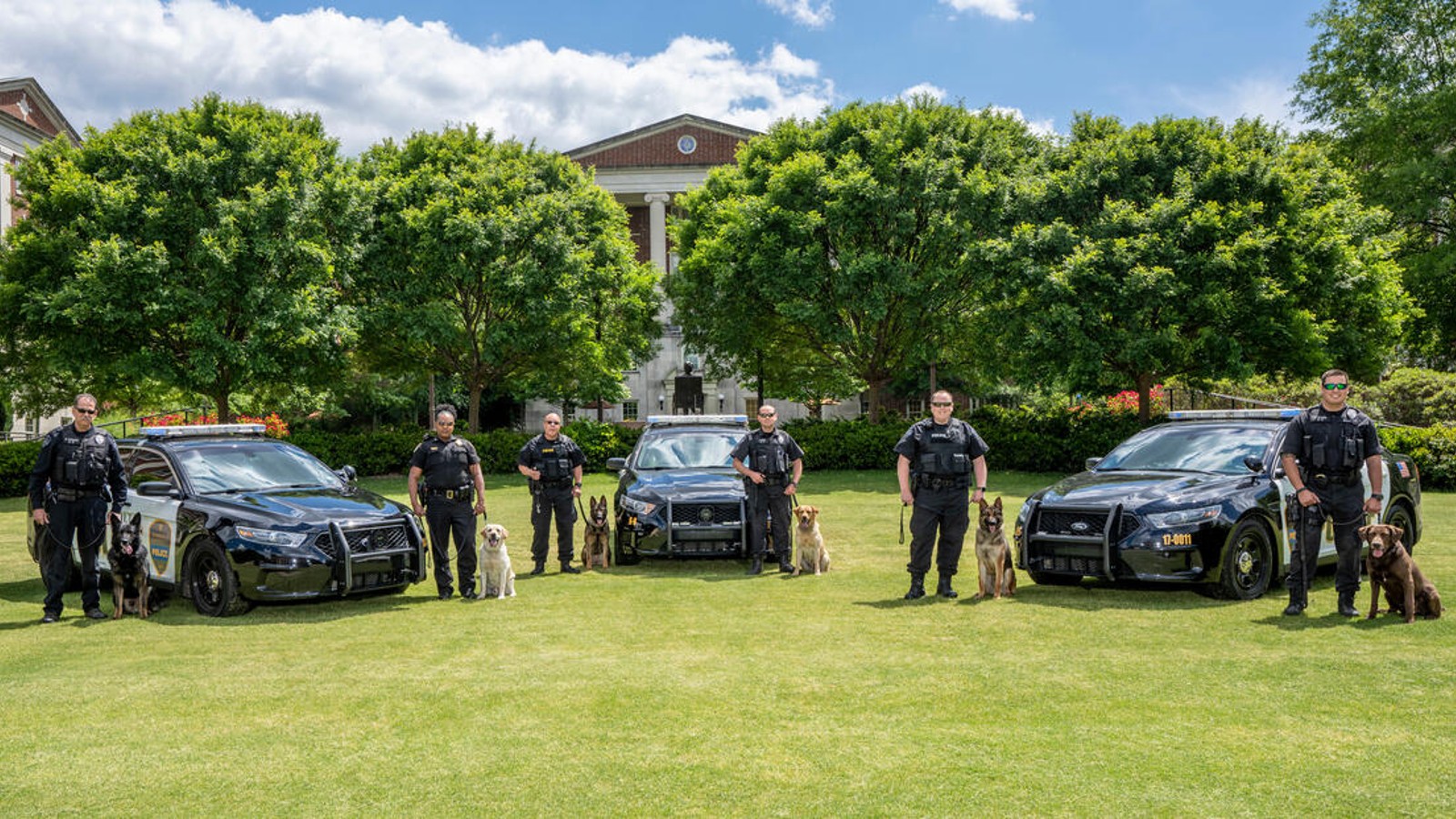 Members of VUPS alongside their K-9 partners.