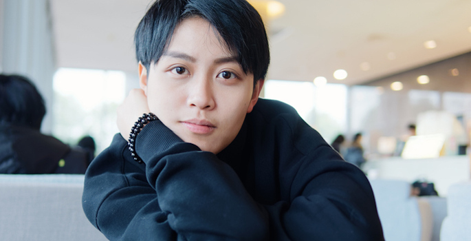 close-up portrait of Asian woman with androgynous short haircut and sweater