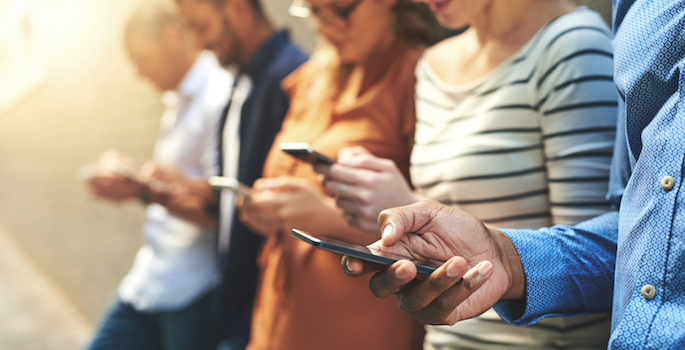 Shot of a diverse group of people social networking outside