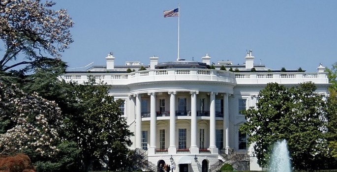 A photo of the White House against a blue sky