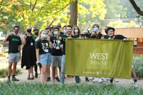 Students march representing each Ingram Commons house.