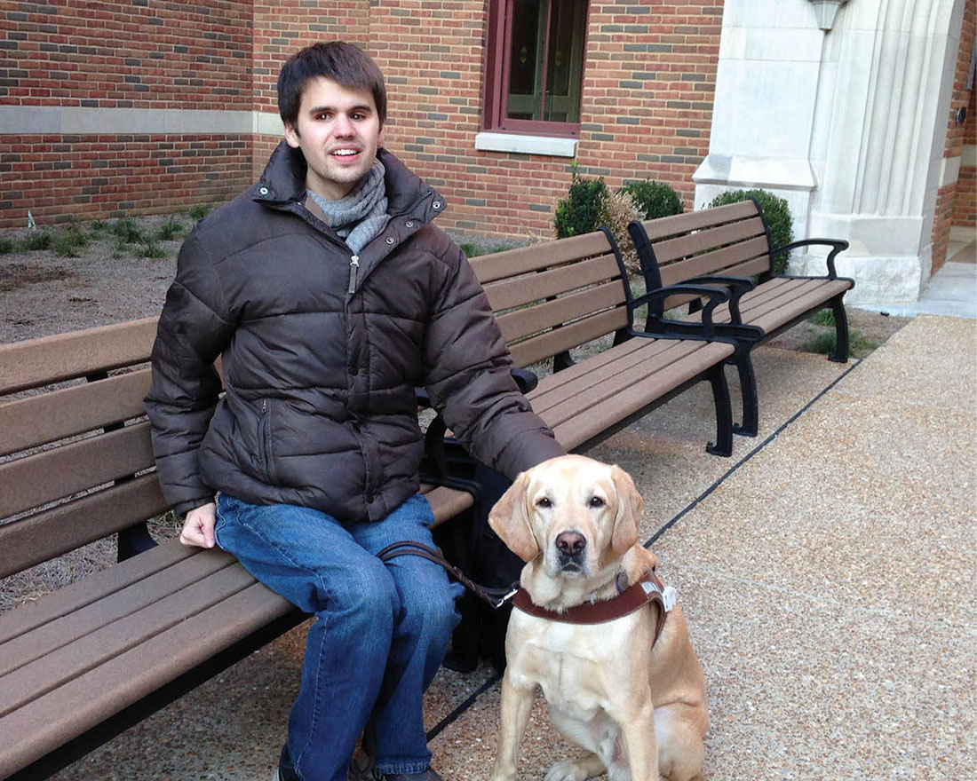 photo of Kelby Carlson and his service dog, Elvis