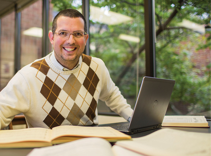 Prof. Douglas Shadle with laptop at the Wilson Music Library