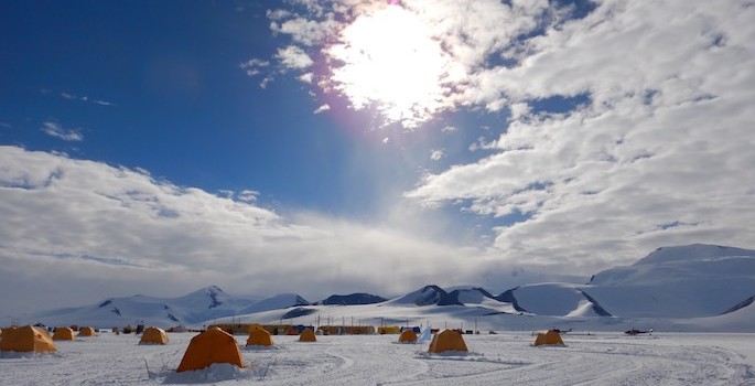 tiny orange tents in the snow