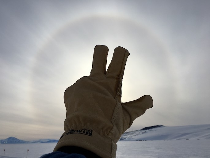VU handsign against antarctic sun