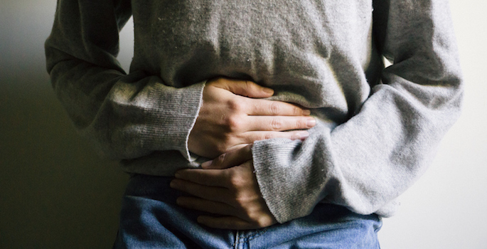 woman with hands on belly