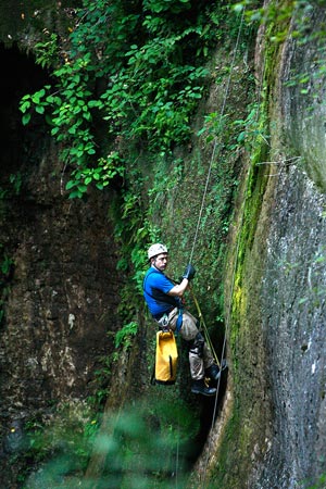 Bachmann-Hickman-rappelling Caving expert John Hickman, who accompanies Bachmann on his underground expeditions, repels down to the entrance of the Snail Shell Cave near Murfreesboro, Tenn.