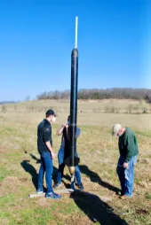 Reisner inspects the full-scale rocket on the launch pad.