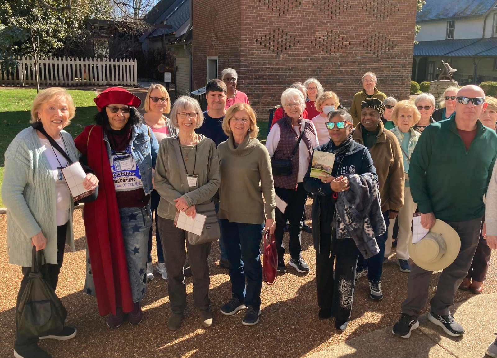 members and guests of OLLI at Vanderbilt pose for photo outside of the Belle Meade Historic Site and Winery during an OLLI field trip..  