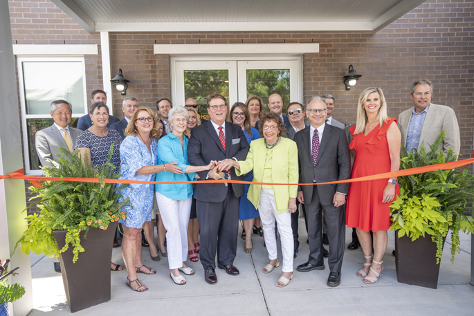 Supporters cut the ribbon last week to celebrate the newly expanded and renamed Pinson Hospital Hospitality House, which provides lodging for families and long-term patients at Nashville-area hospitals. Front row, from left are Board Chair Lisa Slipkovich, Ann Krenson, board member C. Wright Pinson, MBA, MD, Mickey Beazley, Metro Mayor David Briley and Hospitality House Executive Director Angie Stiff. Beazley and Krenson led efforts to open the original facility in 1974. Currently located at 214 Reidhurst Ave., it was renamed at the request of philanthropists Jim and Janet Ayers (not pictured), major contributors to the renovation. “We are thrilled that the Pinson Hospital Hospitality House will be able to now accommodate even more families that are impacted by extended illnesses and injuries and have the added burden of finding affordable lodging,” said Janet Ayers.  