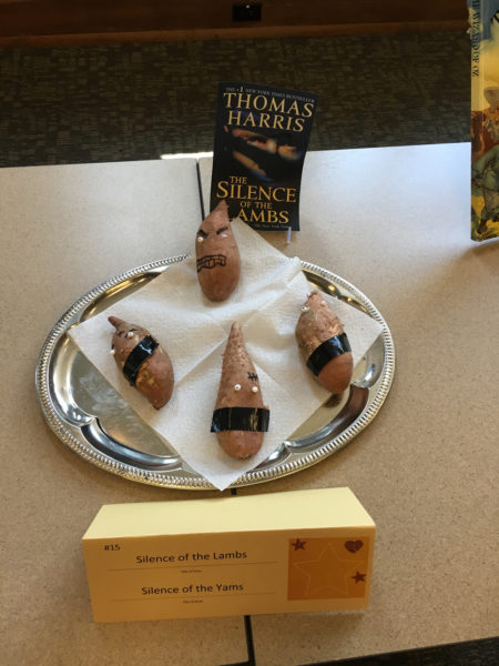 Yams with eyes and tape over where a mouth would be below the eyes.