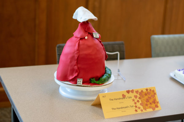 A cake meant to look like the handmaids in their red cloaks and white hats.