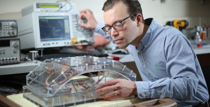 Grissom manipulating ultrasound machine