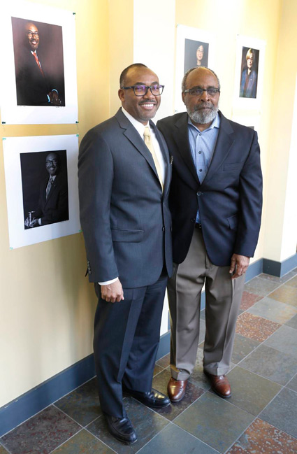 William Robinson, left, associate dean of the School of Engineering, poses with Lucius Outlaw Jr., philosophy professor and the portrait photographer for the Vanderbilt Pioneers series. Outlaw's work was unveiled Tuesday at the Bishop Joseph Johnson Black Culture Center. (Steve Green/Vanderbilt)