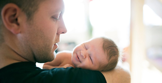 Dad holding baby