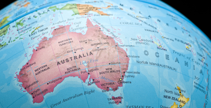 Close-up photo of globe featuring Australia, Indonesia, New Zealand, Papua New Guinea, and portions of other surrounding island nations.