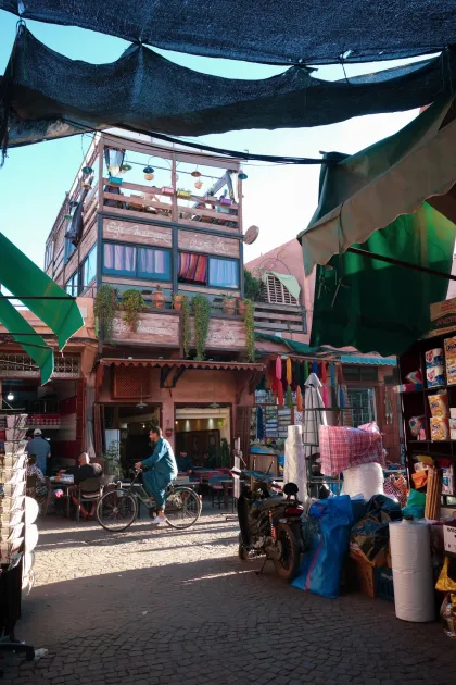 Lina Migliore in Morocco "This photo is from the bustling Jemaa el-Fnaa marketplace in Marrakech, Morocco, during the serene moments of sundown. Amidst the vibrant chaos of the souq, where vendors call out their wares, children's laughter echoes, and an array of sounds fill the air, this photograph freezes a peaceful and beautiful scene. This snapshot reflects a common theme in Morocco—a country brimming with vibrant energy and diverse experiences. Yet, if you take a moment to look, you'll always find pockets of tranquility and beauty amid the lively hustle."