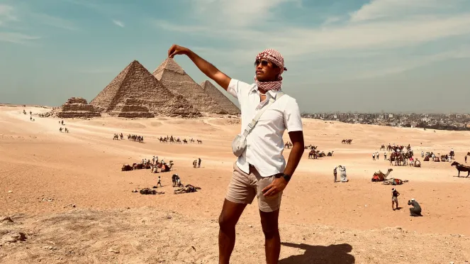 Zachary Gapusan in Egypt "A dream come true: Checking off a major bucket list item with this awe-inspiring view of the Great Pyramids of Giza! Standing before these ancient marvels, I was in absolute awe of their grandeur and timeless beauty. The experience of seeing these colossal structures up close is surreal, and I feel incredibly grateful to witness such a magnificent piece of history. This moment, surrounded by the ancient sands of Egypt and the bleats of camels, is one I'll cherish forever!"