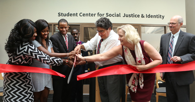 L-r: Transition Programs Director Christiana Russell, Vanderbilt Student Government President Jami Cox, Multicultural Leadership Council President Jacob Pierce, IICC Assistant Director Greg Fontus, Chancellor Nicholas S. Zeppos, Provost Susan R. Wente and Dean of Students Mark Bandas help cut the ribbon to open Vanderbilt’s new Student Center for Social Justice and Identity Sept. 19 at Sarratt Student Center. (Anne Rayner/Vanderbilt)