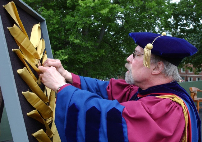 photograph of Carter Philips dressed in Commencement robe
