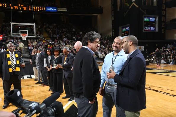 Chancellor Nicholas S. Zeppos (left) with Walter Murray's sons Shawn Murray and James Murray