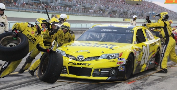 pit crew changing tire